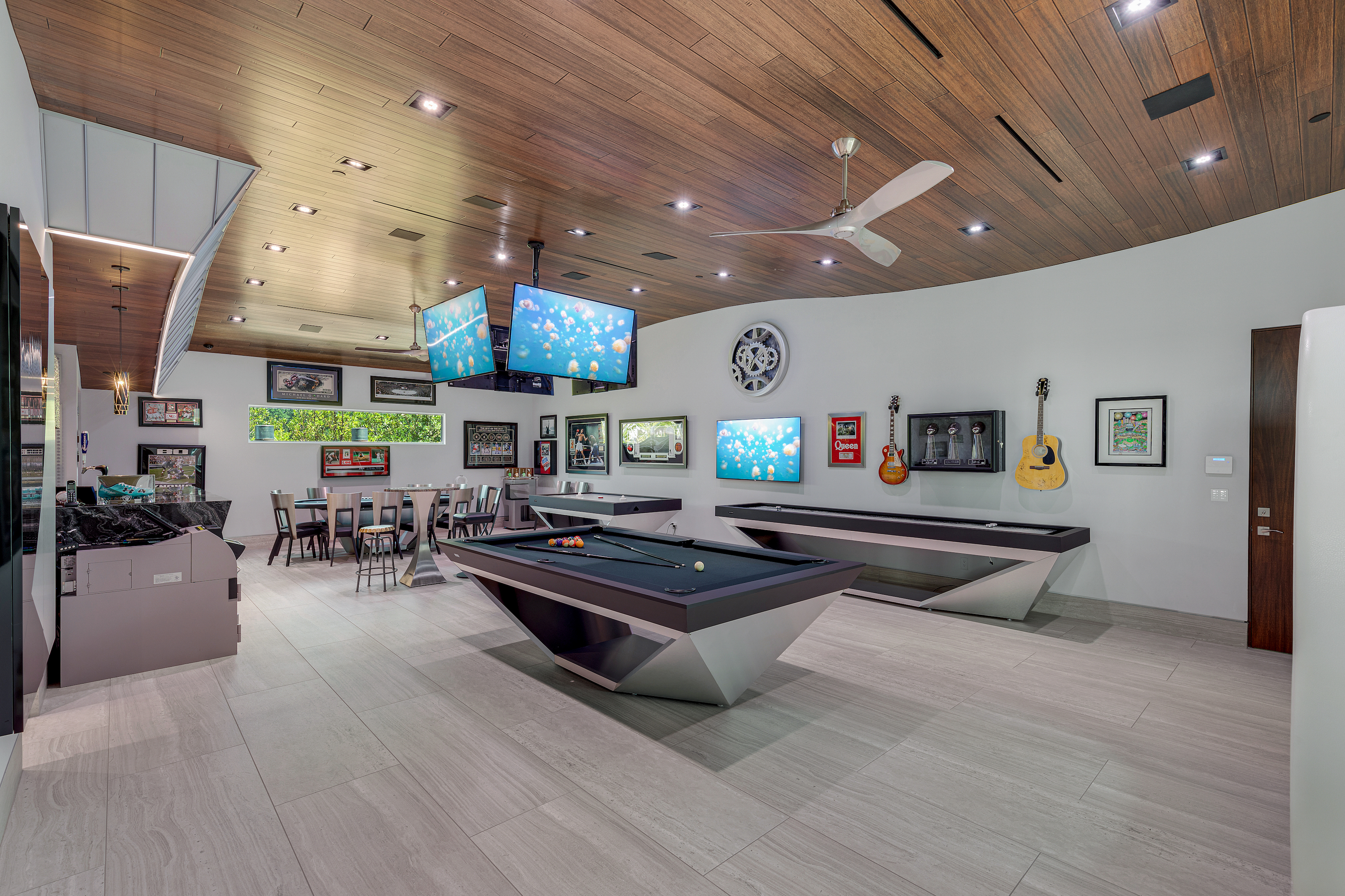 Entertainment room featuring pool table and shuffleboard.