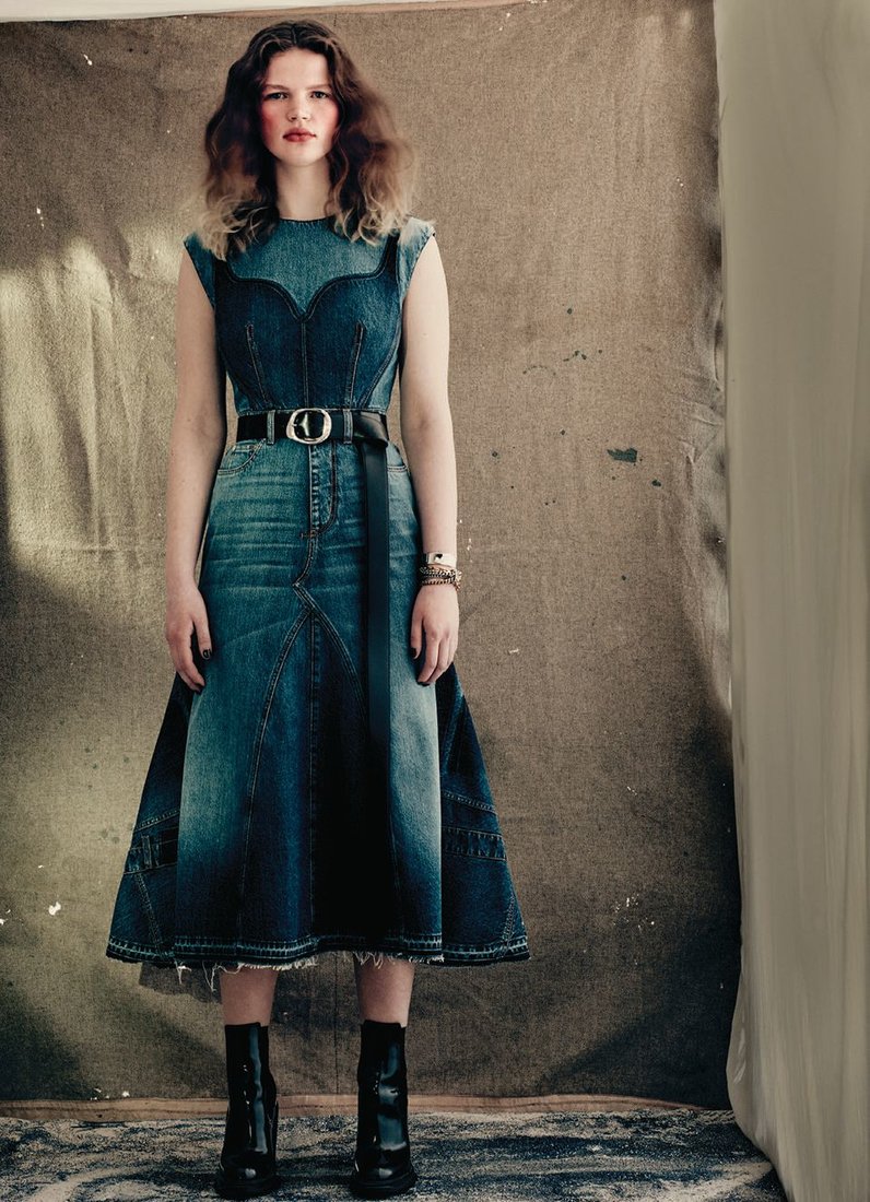Alexander McQueen bustier denim top, fluted panelled skirt, long Molten belt and tread-heeled Chelsea boots. PHOTO BY: PAOLO ROVERSI