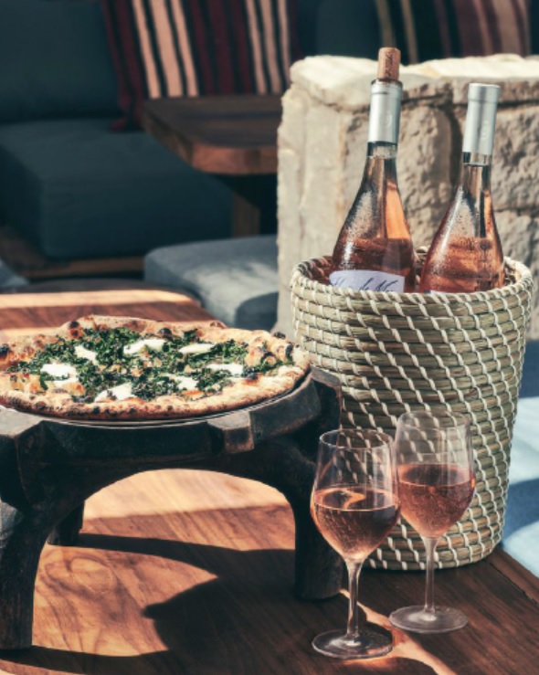 Order bottle service and a sausage and broccoli rabe pizza at Kassi Beach House. PHOTO COURTESY OF: KASSI BEACH CLUB
