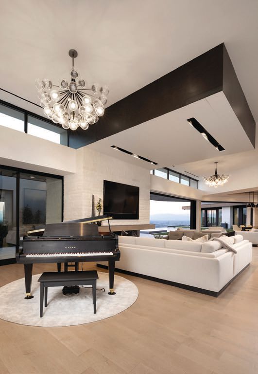 Ample square footage and soaring ceilings allow for artful pieces to shine, including luxurious grand pianos and shimmering chandeliers. PHOTO BY JOHN MARTORANO