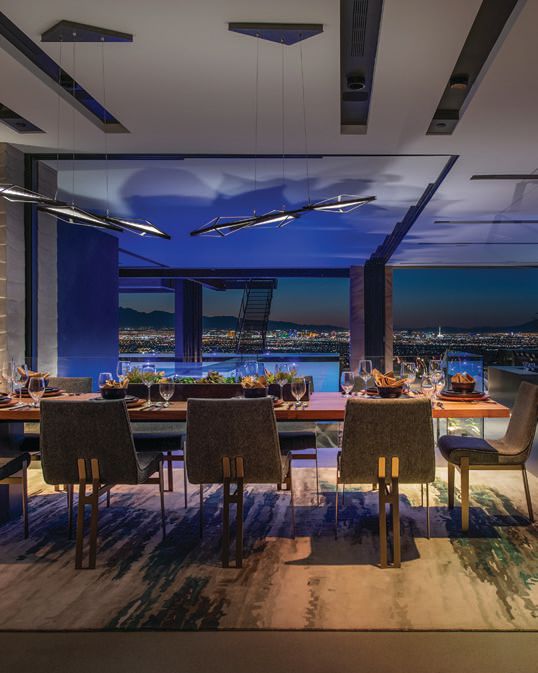 The sleek dining room boasts seating for up to 10. PHOTO COURTESY OF BLUE HERON