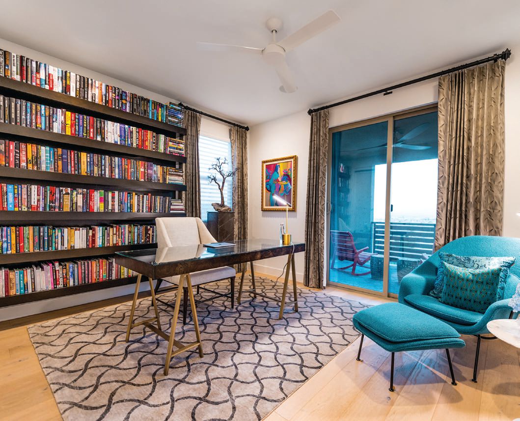 The home office features one of three custom-designed bookcases in the home as the owner shave an extensive collection of rare and limited-edition books PHOTO BY GRACIE HENLEY/PREMIER PROPERTY TOURS