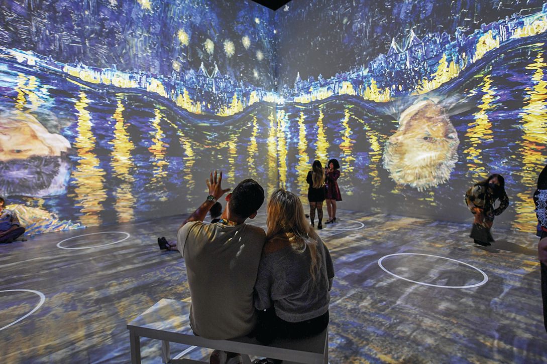The Original Immersive Van Gogh Exhibit has social distancing circles programmed into the projection to maintain safety. PHOTO BY DENISE TRUSCELLO