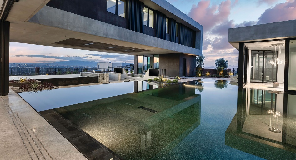 The home’s raised infinity-edge pools give the property a feeling of floating on water. PHOTO BY JPM STUDIOS
