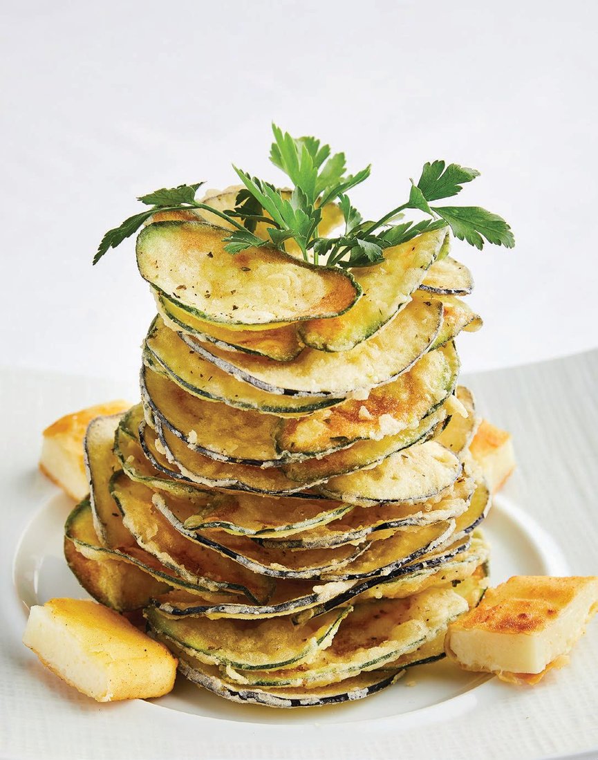 The Milos Special—a lightly fried zucchini and eggplant tower with kefalograviera cheese and tzatziki—at Estiatorio Milos PHOTO COURTESY OF THE VENETIAN RESORT