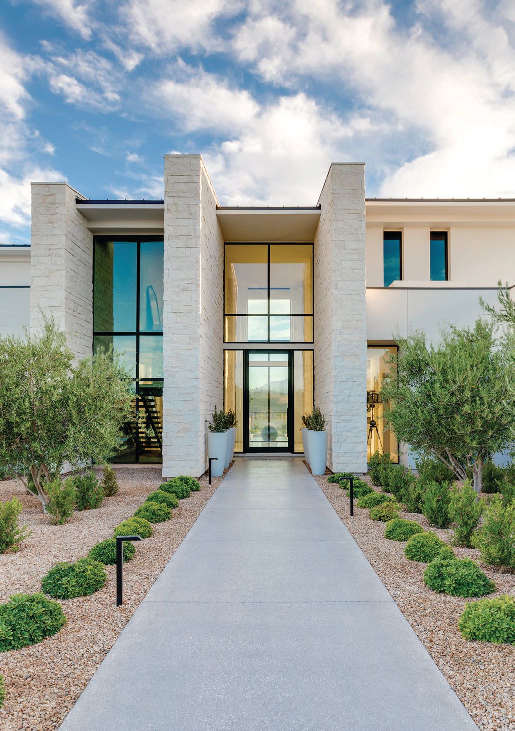 Palatial stone columns frame the home’s exquisite entryway PHOTO BY STETSON YBARRA