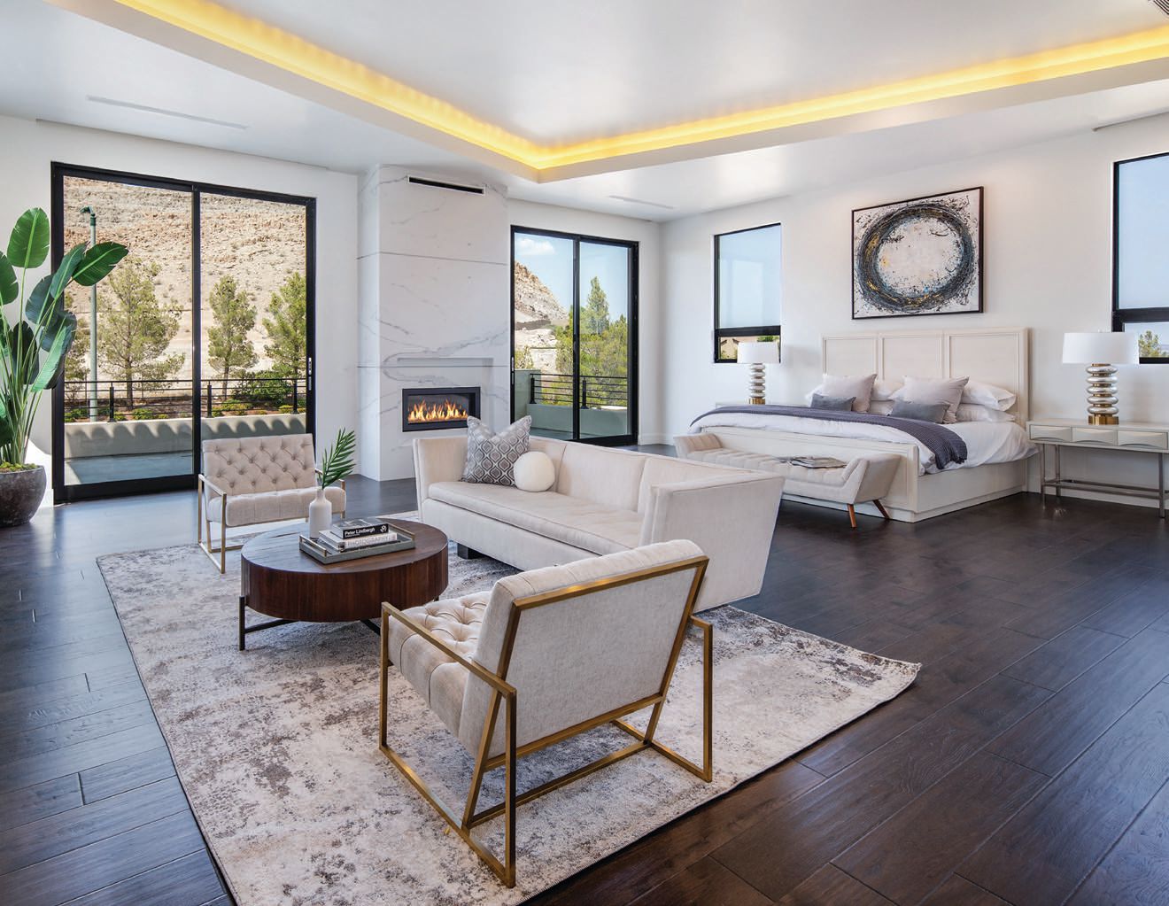 The expansive primary bedroom includes a sitting area and fireplace PHOTO COURTESY OF THE IVAN SHER GROUP