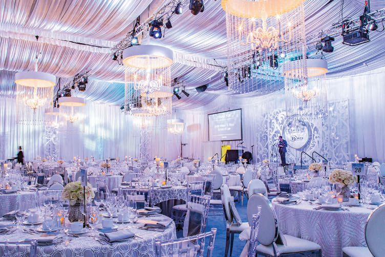 A look at the dazzling decor at 2018’s Camelot at the Magical Forest. This year, the event will toast Opportunity Village’s 20th anniversary. PHOTO: COURTESY BY MIGNON LAZATIN/OPPORTUNITY VILLAGE; *AT THE TIME OF PRESS, CELINE DION DELAYED THE OPENING OF HER RESIDENCY AT RESORTS WORLD LAS VEGAS
