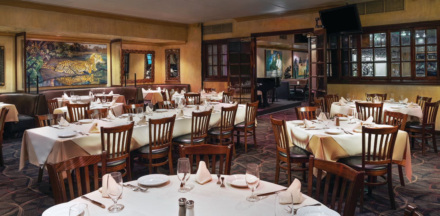 The timeless dining room at Piero’s includes classic white tablecloths PHOTO BY: ANTHONY MAIR 