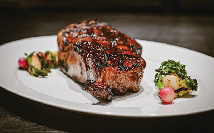 A perfectly charred Kansas City strip. STEAK PHOTO COURTSY OF HARLO STEAKHOUSE AND BAR
